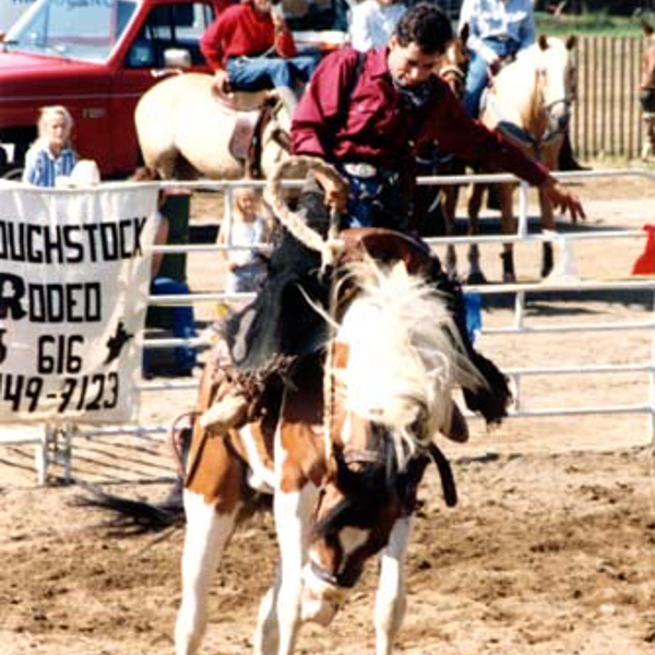 1980s youth riding saddle bronc rodel