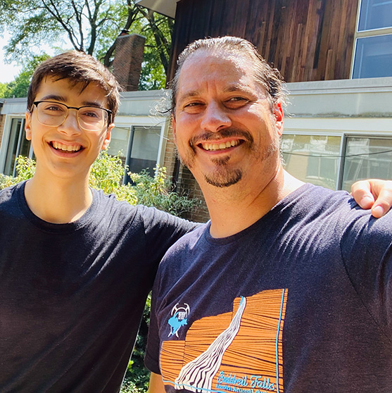 Father and son smiling