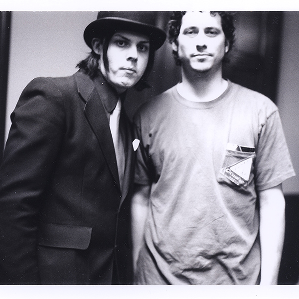 Jack White and man in frumpy tee shirt because he was up all the night before working on a new camera technique