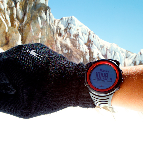 Close up altimeter on a watch on a wrist in the mountains