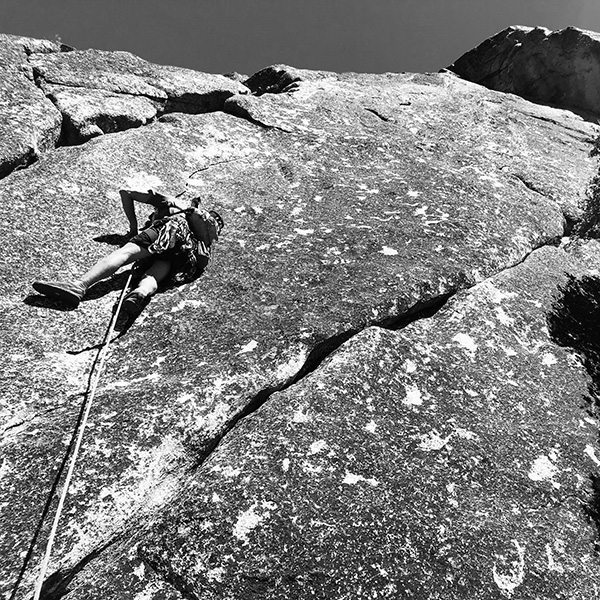 Rock climber on rock face of the Manure Pile in Yosemite National Park