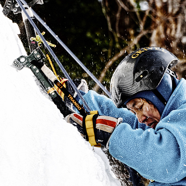 Close up of ice climber climbing
