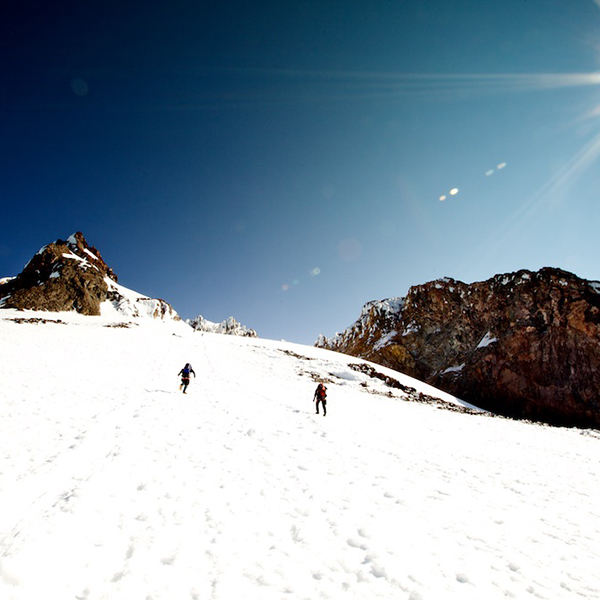 Two mountaineers ascend Mount Hood