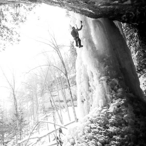Ice climber on pillar of ice at the Amphitheater in the Upper Peninsula of Michigan