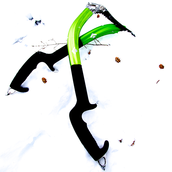 Ice climbing tools laying in the snow