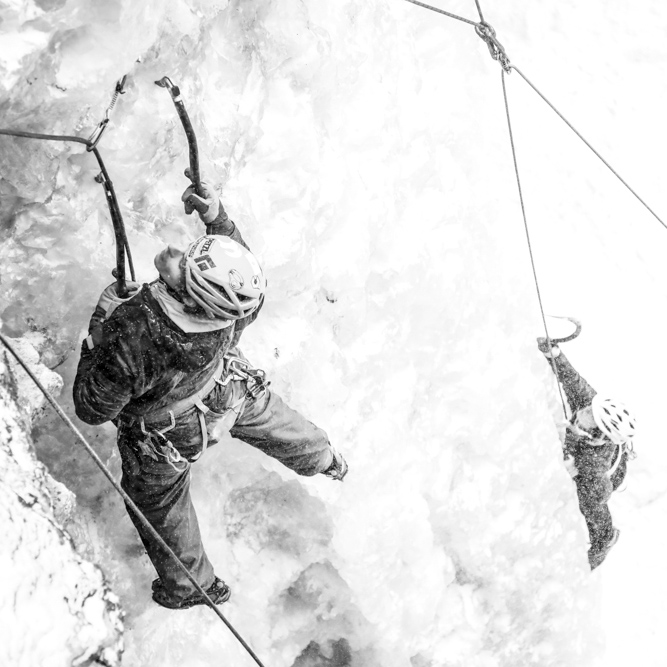 Ice climbers climbing in snow storm in Munising Michigan