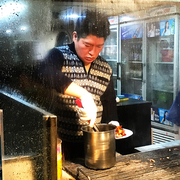 Street view of a Korean cooking in a restaurant