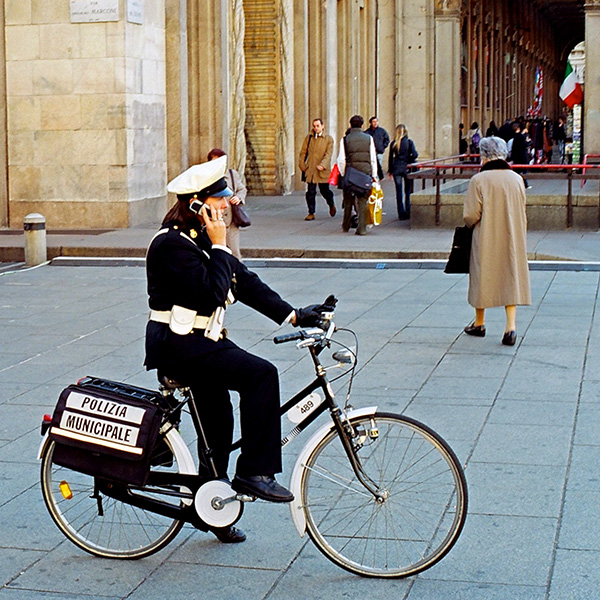 Female police officer on bicycle in Milan