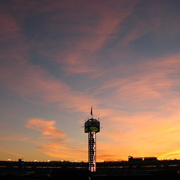 Phoenix Raceway leaderboard pole against sunset sky