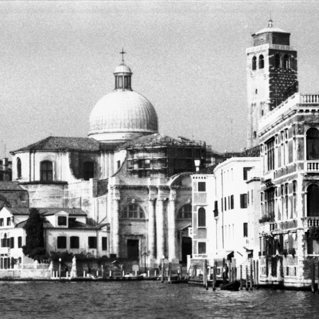 Canal view of buildings in venice in black and white
