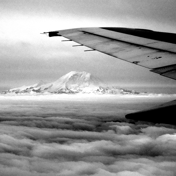 View of Mount Rainier out the window of a plane